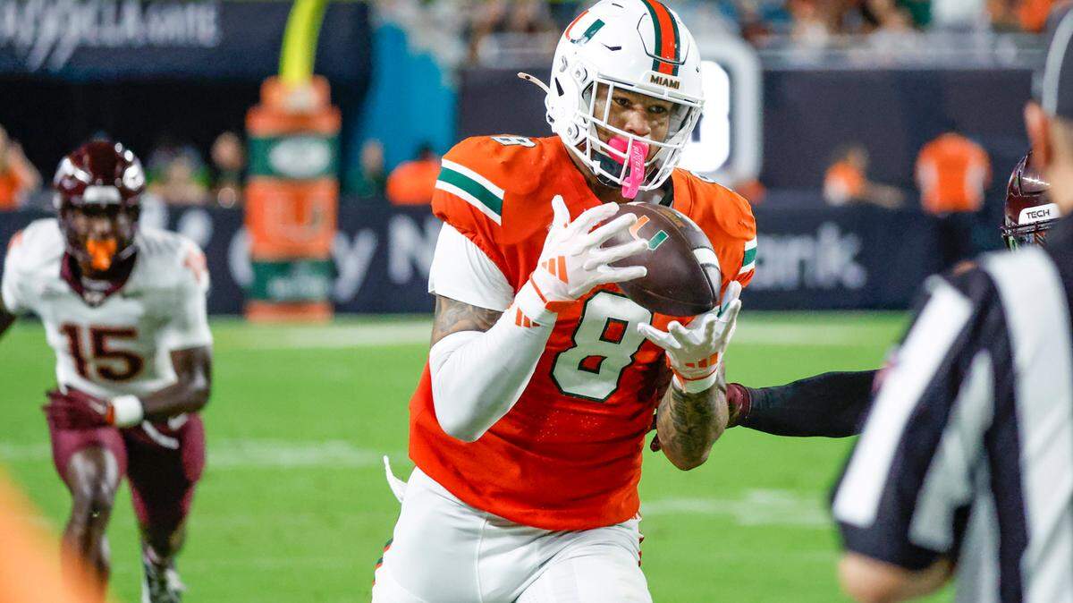 Miami Hurricanes tight end Elijah Arroyo (8) on a long pass reception against the Virginia Tech Hokies during the first half of an ACC conference football game at Hard Rock Stadium on Friday, September 27, 2024, in Miami Gardens, Fla.