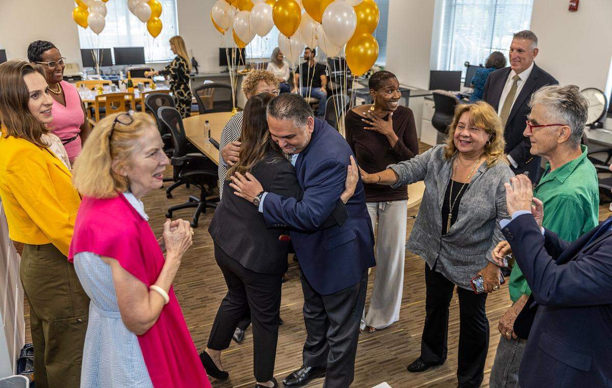 Miami Herald/el Nuevo Herald Executive Editor Alex Mena congratulates members of the Miami Herald editorial board Amy Driscoll, Nancy Ancrum and Luisa Yanez after the announcement of the Pulitzer Prize for Driscoll’s “Broken Promises” series on May 8, 2023.