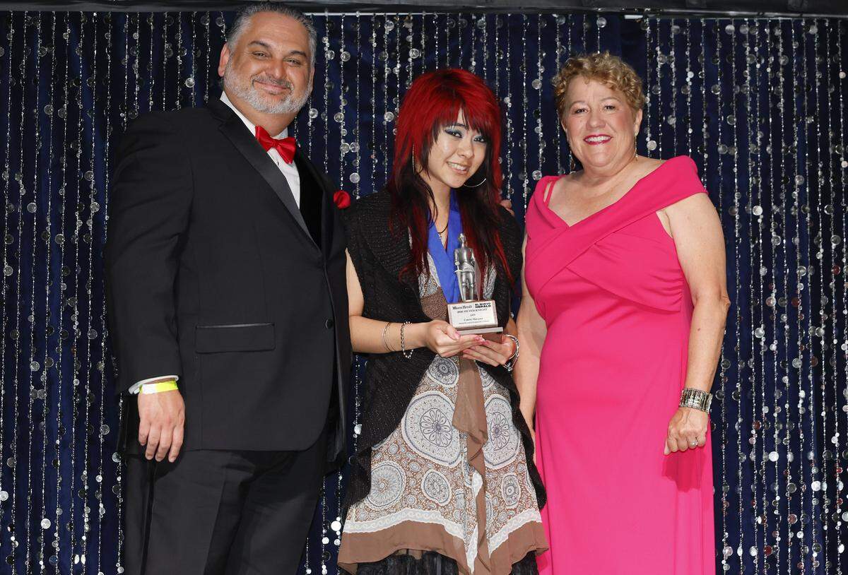 Silver Knight Arts winner Colette Marquez, from North Broward Preparatory School, poses with Alex Mena, Executive Editor of the Miami Herald & el Nuevo Herald and Dana Banker, Managing Editor at the Miami Herald. 