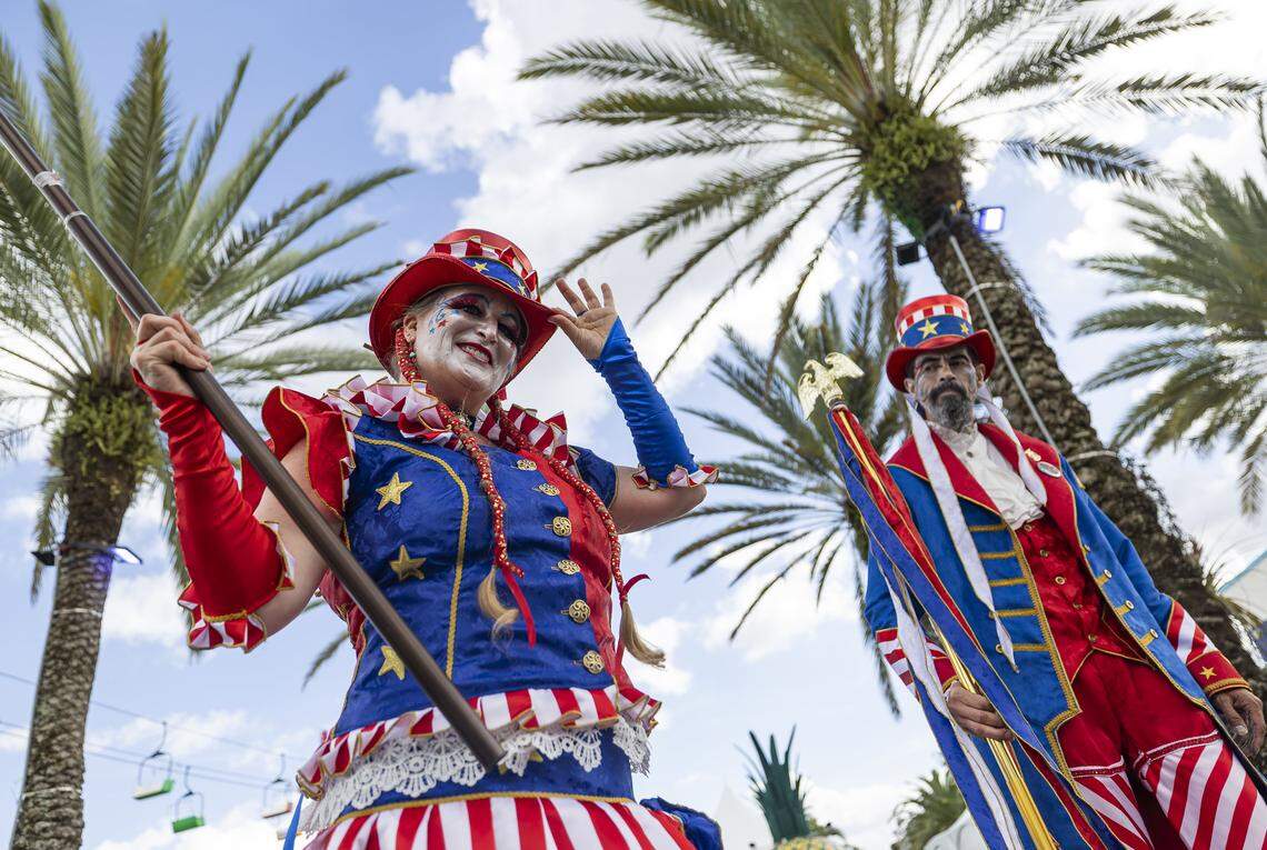 Star Child and Rich Dalton, members of the Stilt Circus, greet guests as they attend the opening day of the 74th annual Miami-Dade County Youth Fair on Thursday, March 12, 2026, in Miami, Fla.