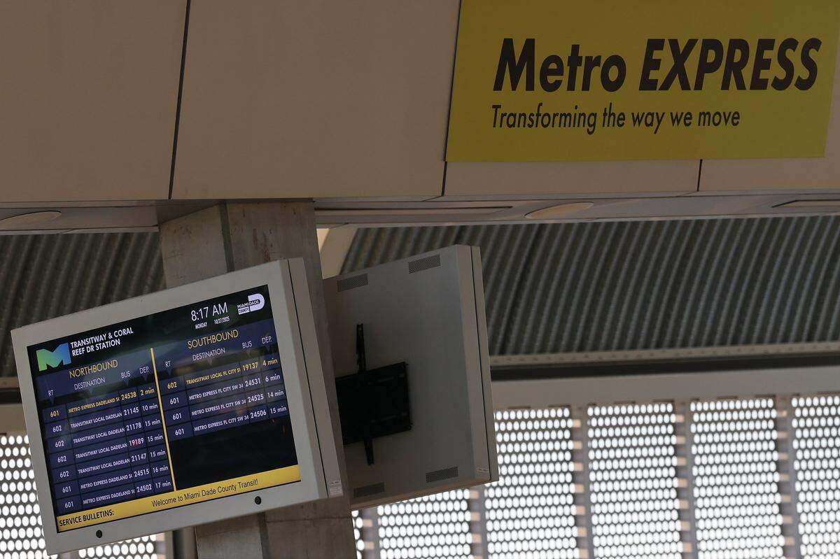 Several screens display the arrival of northbound and southbound Metro Express buses at the 152 Street Station on the first day of Miami-Dade's $300 million rapid-transit bus line known as “Metro Express” on Monday, October 27, 2025, just west of Richmond Heights on Coral Reef Drive and U.S. 1.  Many first day riders complained about crowded buses and long travel times due to red lights on the express lane.
