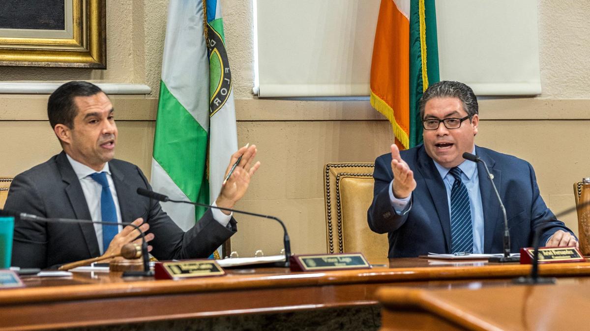 Coral Gables Mayor Vince Lago (left) and Commissioner Ariel Fernandez (right) exchange words during a meeting at Coral Gables City Hall on Tuesday, April 16, 2024.