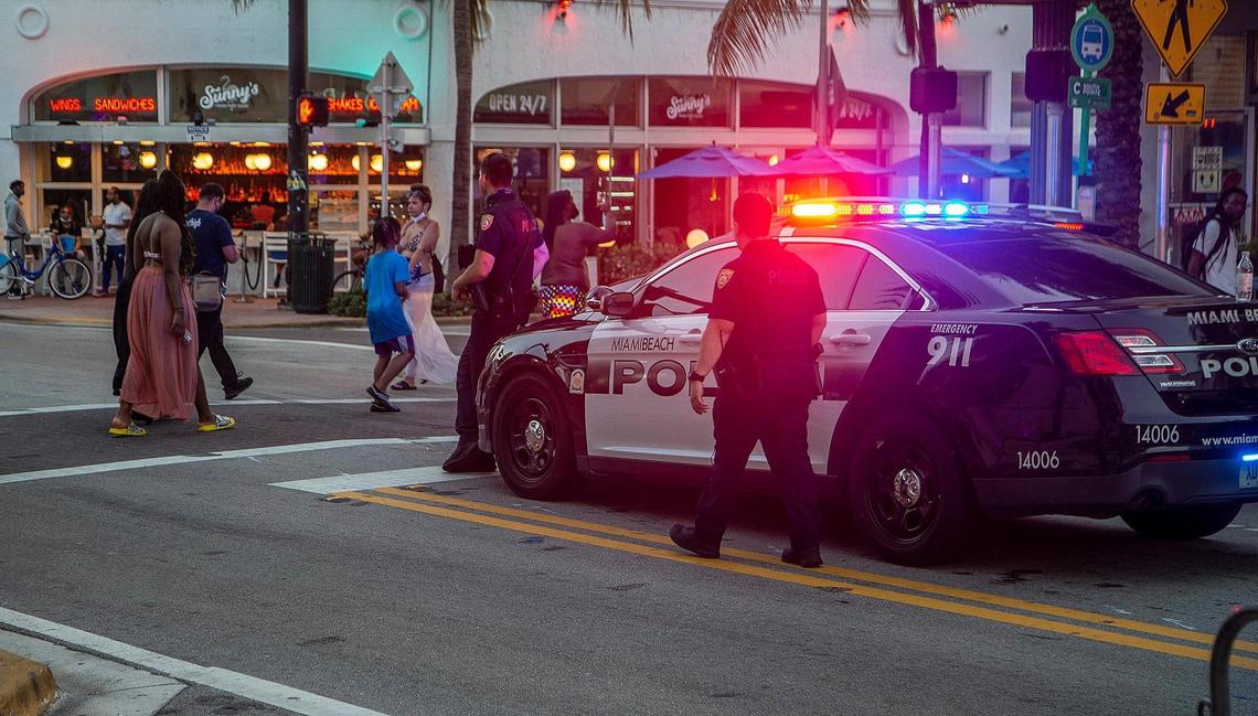 City of Miami Beach Police officers are seen along Collins Avenue in South Beach on Wednesday, March 24, 2021.