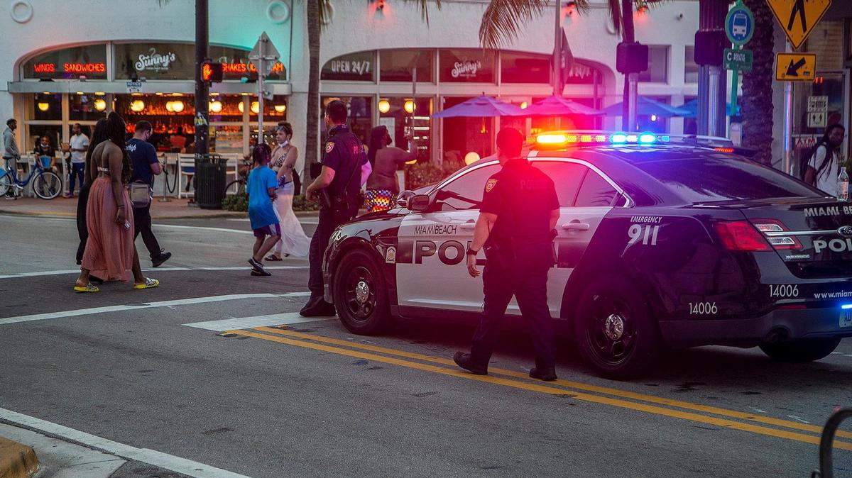 City of Miami Beach Police officers are seen along Collins Avenue in South Beach on Wednesday, March 24, 2021.