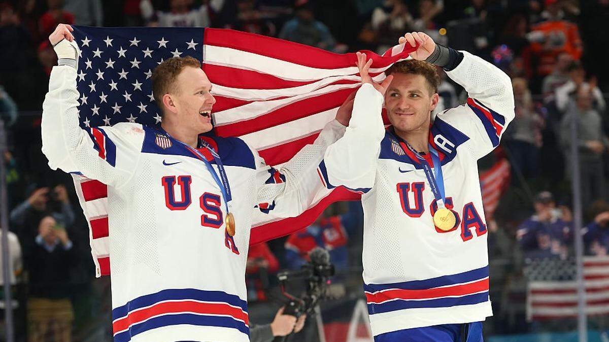 MILAN, ITALY - FEBRUARY 22: Gold medalists Brady Tkachuk #7 and Matthew Tkachuk #19 of Team United States celebrates after the medal ceremony for Men's Ice Hockey following the Men's Gold Medal match between Canada and the United States on day 16 of the Milano Cortina 2026 Winter Olympic games at Milano Santagiulia Ice Hockey Arena on February 22, 2026 in Milan, Italy. (Photo by Gregory Shamus/Getty Images)