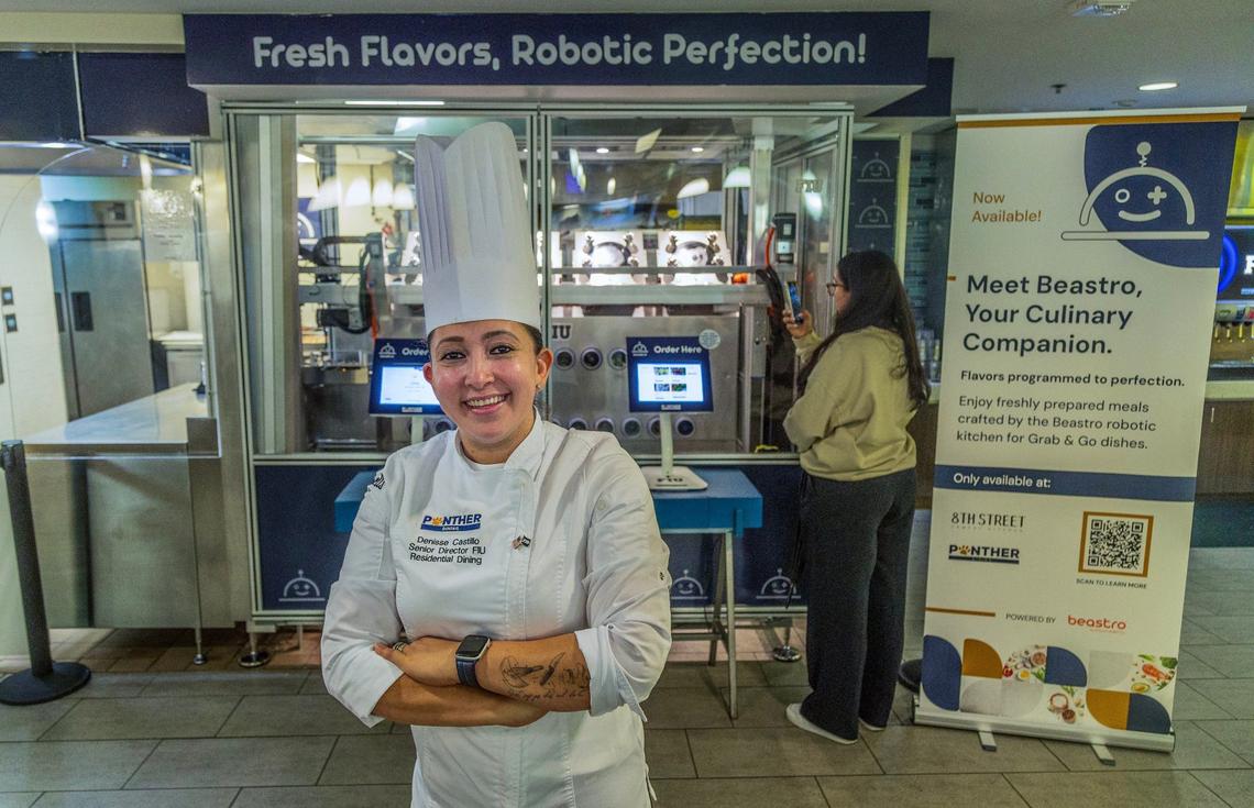 Chef Denisse Castillo in front of Beastro, a culinary robotic kitchen from Kitchen Robotics. Castillo and her team create the dishes that Beastro puts together, adding pre-cooked meats and pastas to the machine as well as fresh vegetables and sauces.