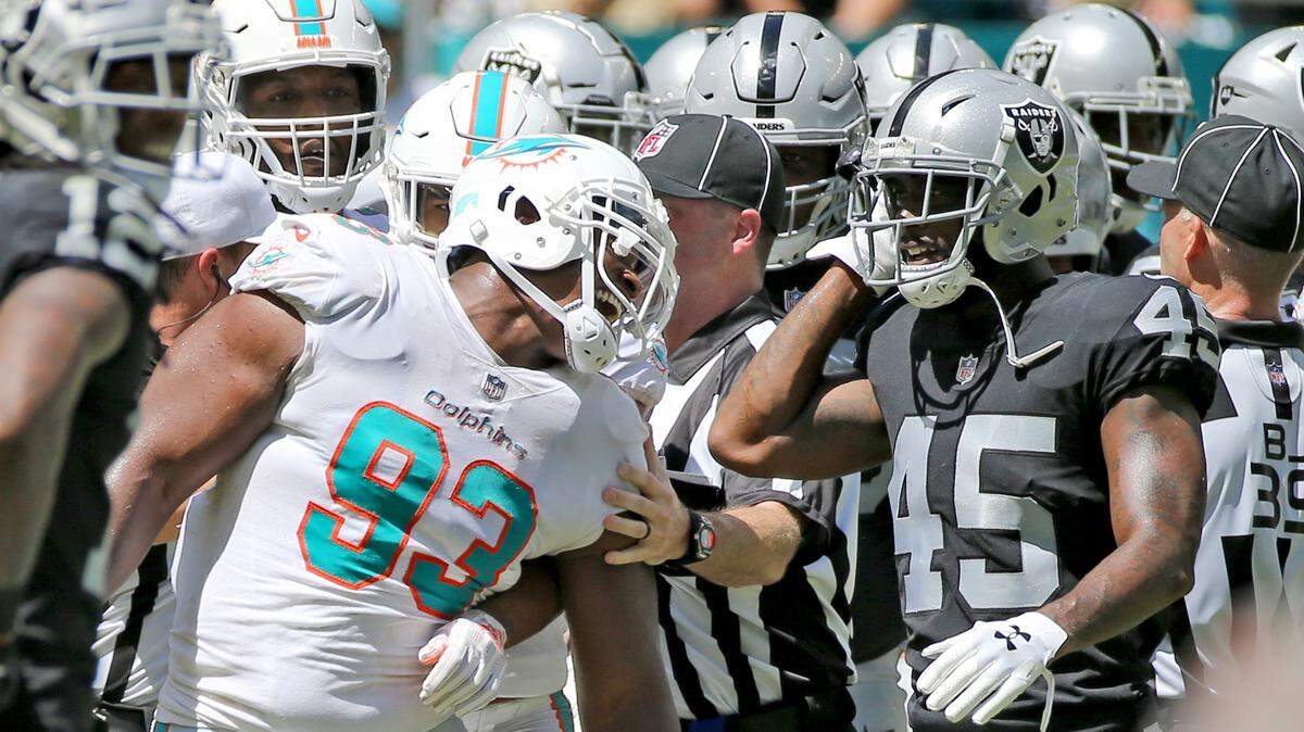 Miami Dolphins Akeem Spense (93) gets in an altercation with Oakland Raiders Dominique Rodgers-Cromartie (45) in the second quarter at Hard Rock Stadium Fl, Sunday, September, 23, 2018.