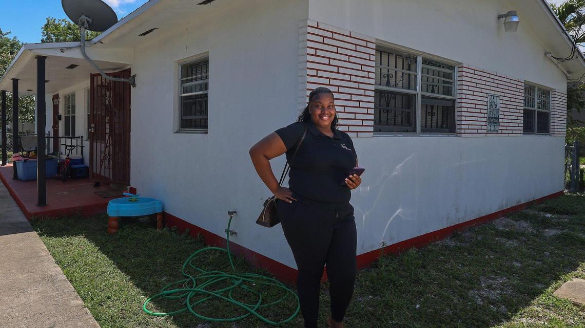 Sabrina Guillaume stands outside the duplex she owns in Liberty City on Sunday, April 14, 2025.