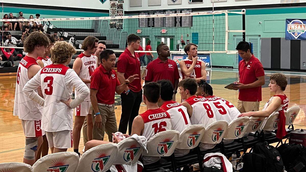 Cardinal Gibbons’ boys’ volleyball team discusses strategy during a timeout on Friday during its state quarterfinal victory over South Broward at Archbishop McCarthy High School.