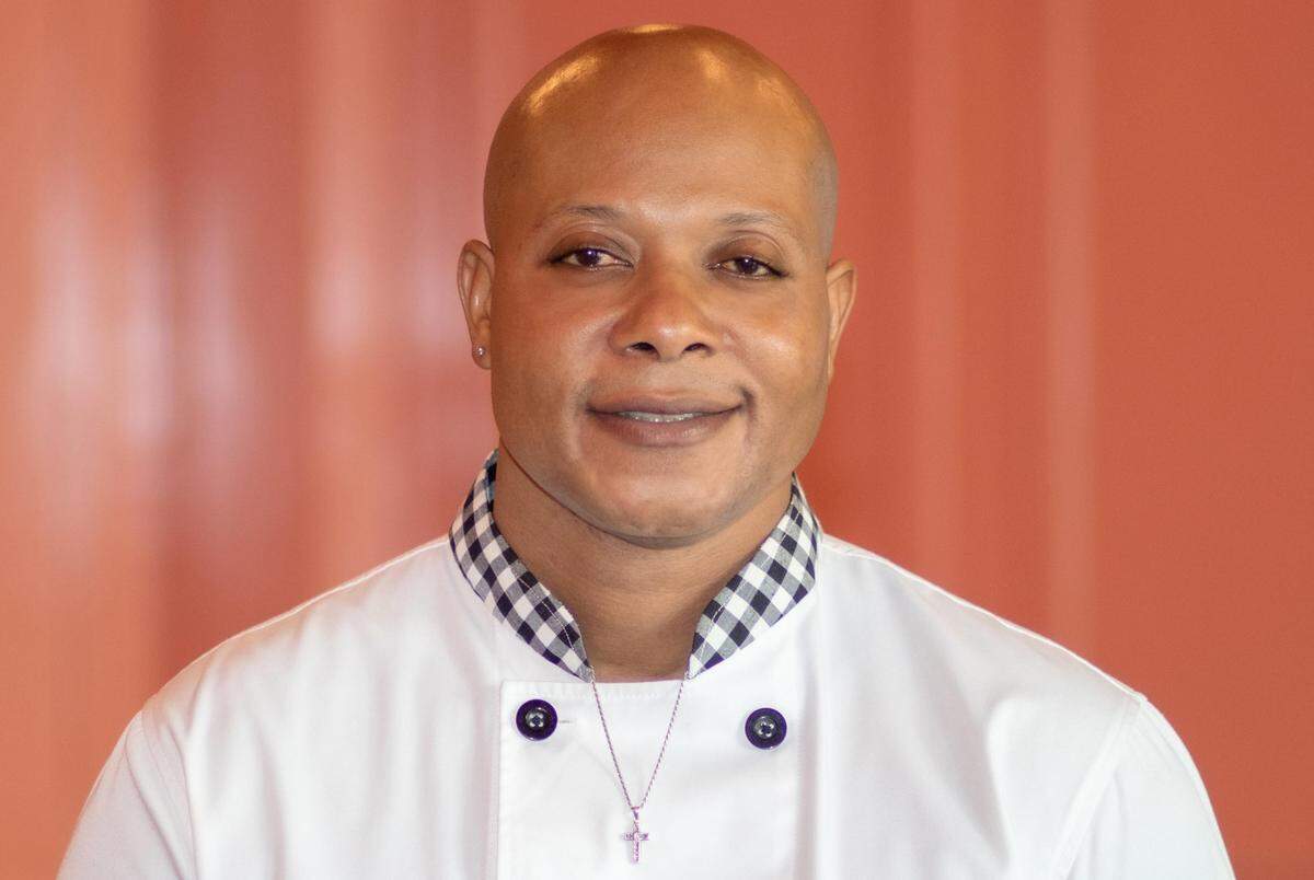 Chef Wayne Sharpe leads the kitchen at the new Jrk! Jamaican restaurant in downtown Miami.