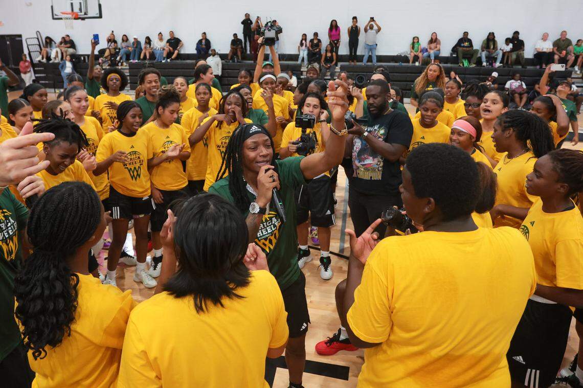 WNBA basketball player Erica Wheeler speaks to campers from inside a huddle during the Erica Wheeler Basketball Camp at Bucky Dent Park at 2240 W 60th St., in Hialeah, Florida, Saturday, October 18, 2025.