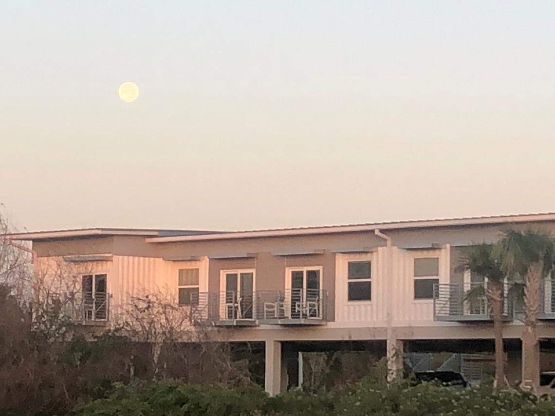 “Snow moon” on Feb. 25, 2024 over the Flamingo Lodge’s newly opened hotel rooms built from shipping containers and named after Everglades birds.
