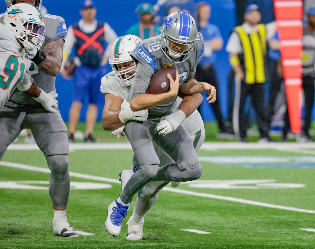 Miami Dolphins defensive tackle Zach Sieler (92) sacks Detroit Lions quarterback Jared Goff (16) in the fourth quarter at Ford Field in Detroit, Michigan on Sunday, October 30, 2022.