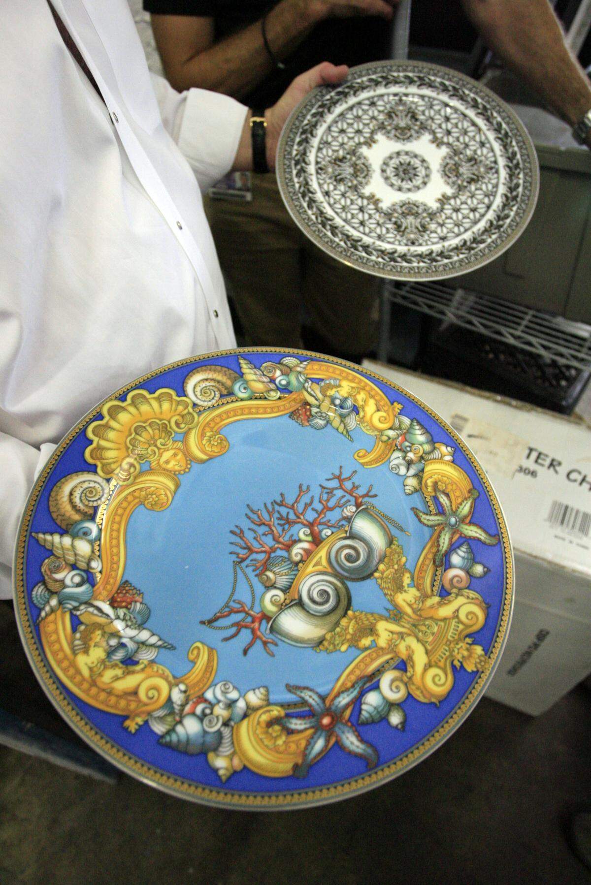In this file photo from Nov. 16, 2005, Versace plates were used in Barton G. Event Design & Production’s catering events. Barton G. Weiss’ company is located in Miami’s Design District.