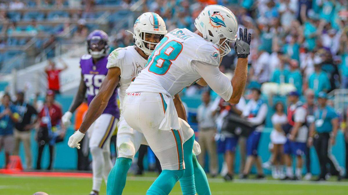 Miami Dolphins tight end Mike Gesicki (88) and running back Raheem Mostert (31) celebrate Gesicki’s touchdown reception in the fourth quarter against the Minnesota Vikings at Hard Rock Stadium in Miami Gardens on Sunday, October 16, 2022.