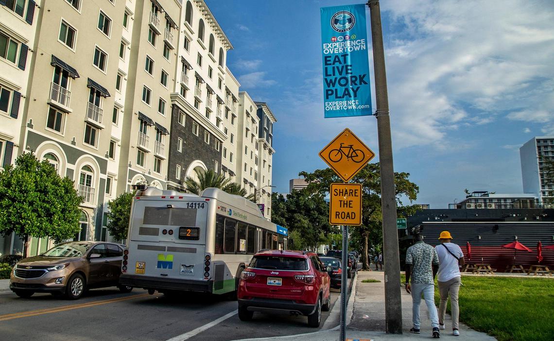 A view of a resurgent Northeast Second Avenue in the heart of Miami’s Overtown neighborhood in April 2021, with the Plaza at the Lyric apartments at left and the new Red Rooster restaurant in the background at right.