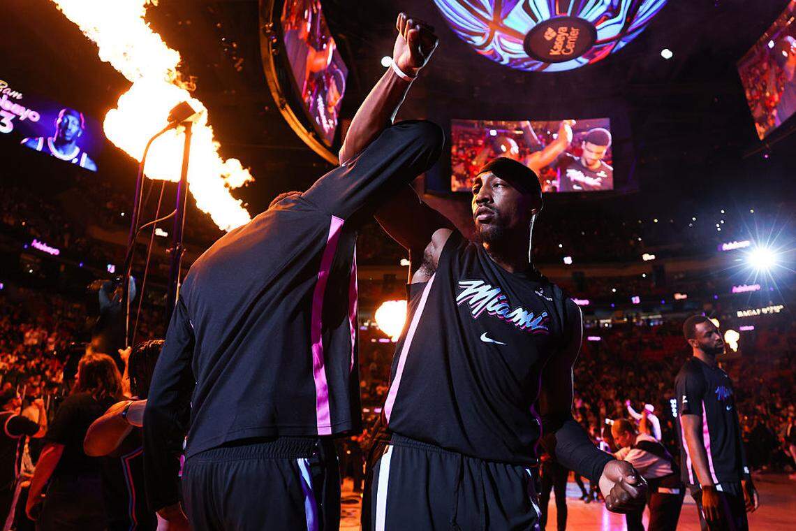 Kel'el Ware #7 and Bam Adebayo #13 of the Miami Heat react prior to a game against the Minnesota Timberwolves at Kaseya Center on January 03, 2026 in Miami.