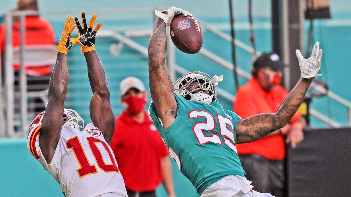 Miami Dolphins cornerback Xavien Howard (25) intercepts the ball intended for Kansas City Chiefs Tyreek Hill (10) in the second half at Hard Rock Stadium in Miami Gardens on Sunday, December 13, 2020. His one handed interception makes it his ninth interception of the season.
