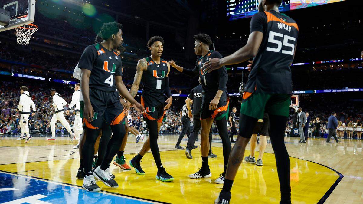 Miami Hurricanes guard Jordan Miller (11) huddle with teammates during the second half of the Men’s Basketball Championship National Semifinal against the Connecticut Huskies at NRG Stadium in Houston, Texas on Saturday, April 1, 2023.