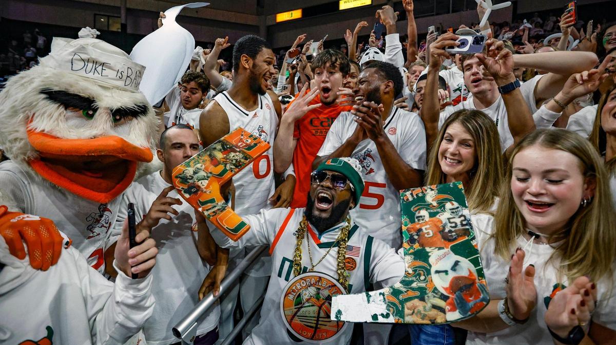 Miami Hurricanes forward A.J. Casey (0) and guard Wooga Poplar (55) celebrate with Canes fans after defeating the Duke Blue Devils at the Watsco Center in Coral Gables, Florida on Monday, February 6, 2023. Hurricanes are hoping for a repeat performance on Wednesday.