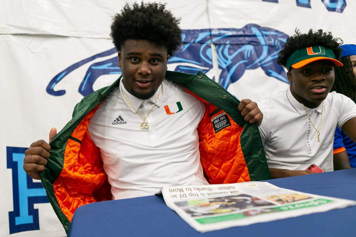 Palmetto seniors Leonard Taylor, left, and Brashard Smith signed letters of intent to play college football at the University of Miami during National Signing Day at Evelyn Greer Park in Pinecrest, Florida on Wednesday, December 16, 2020.