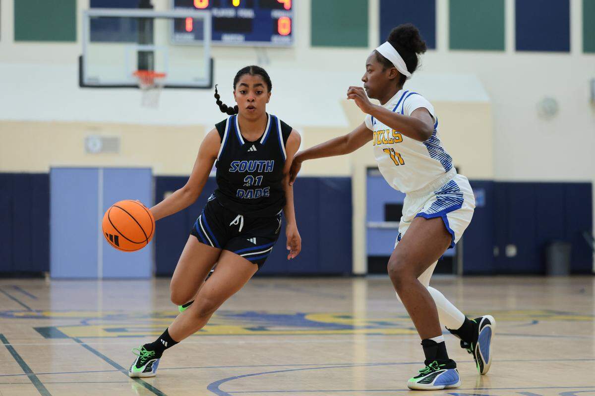 South Dade Buccaneers guard Yarianna Torres (31) drives to the basket against Northwestern Bulls Myah Newton (11) during the first quarter of the Greater Miami Athletic Conference girls basketball finals game at Ronald W. Reagan Doral Senior High School on Saturday, Jan. 24, 2026, in Doral, Fla.