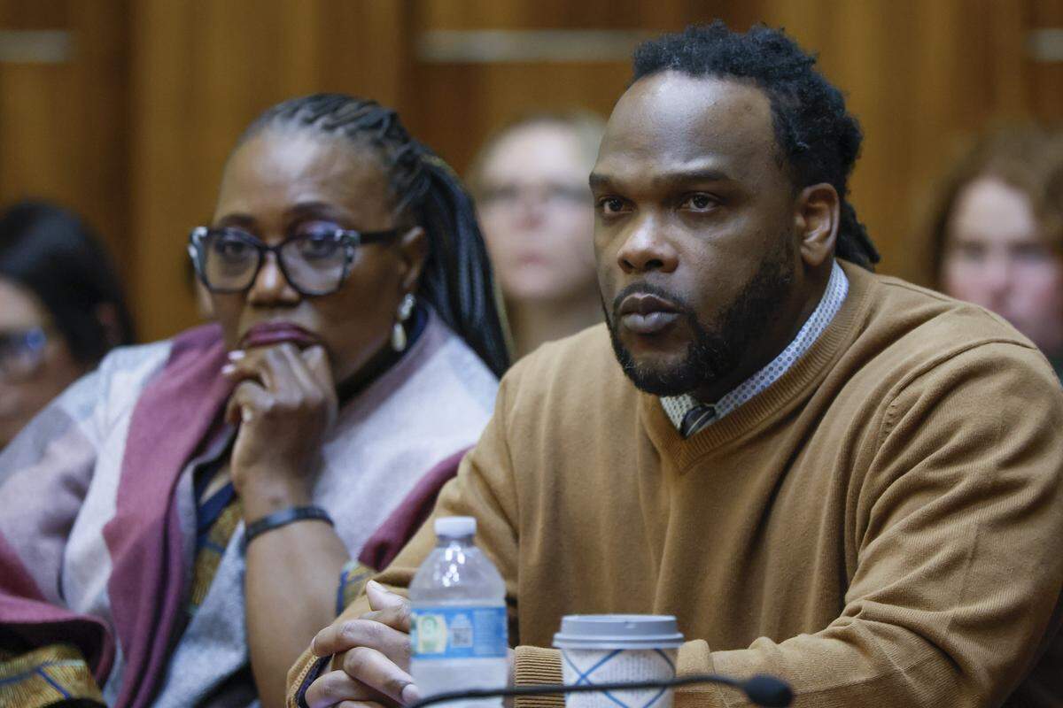 Rashaun Jones, who is accused of killing his University of Miami football teammate Bryan Pata in 2006, listens to opening statements with attorney Bonita E Jones Peabody, in Judge Cristina Miranda’s courtroom at the Richard E. Gerstein Justice Building on Wednesday, Feb. 18, 2026.