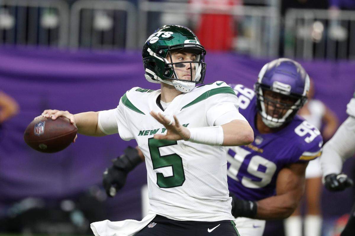 New York Jets quarterback Mike White (5) throws a pass during the second half of an NFL football game against the Minnesota Vikings, Sunday, Dec. 4, 2022, in Minneapolis. (AP Photo/Bruce Kluckhohn)