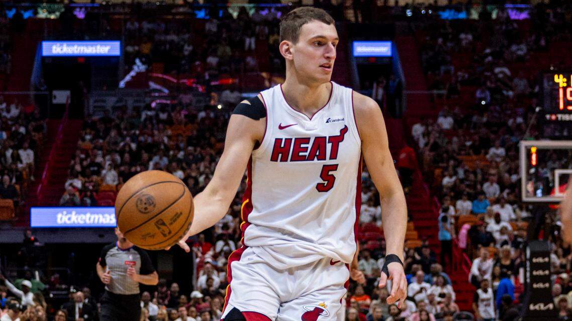 Miami Heat forward Nikola Jovic (5) dribbles the ball during the second half of an NBA game at Kaseya Center in Miami on April 12, 2024.