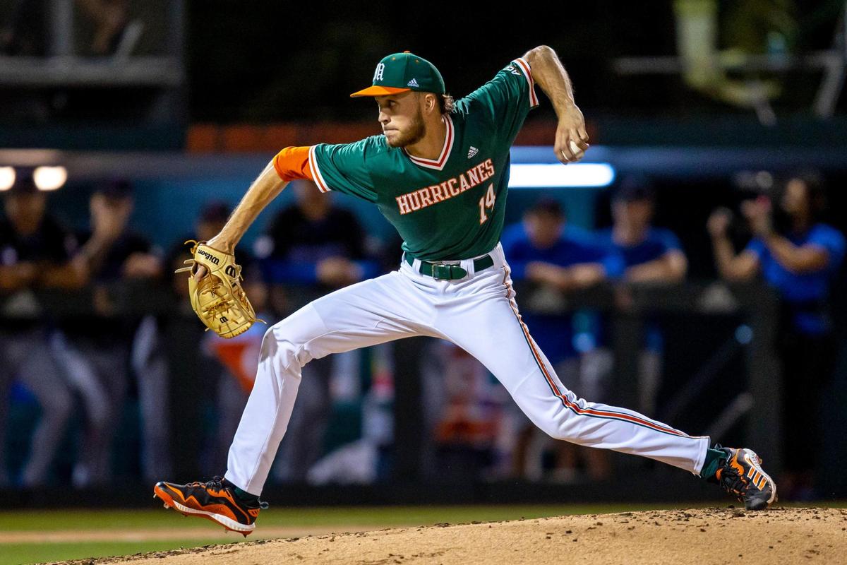 University of Miami pitcher Carson Palmquist (14) throws a pitch during the first inning of an NCAA baseball game against University of Florida inside Alex Rodriguez Park at Mark Light Field in Coral Gables, Florida, on Friday, March 4, 2022.