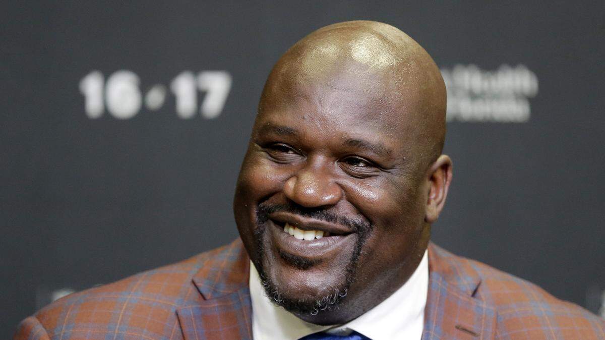 In this Dec. 22, 2016, file photo, retired Hall of Fame basketball player Shaquille O'Neal smiles as he talks to reporters during an NBA basketball news conference in Miami. O'Neal stars in the basketball comedy, "Uncle Drew."