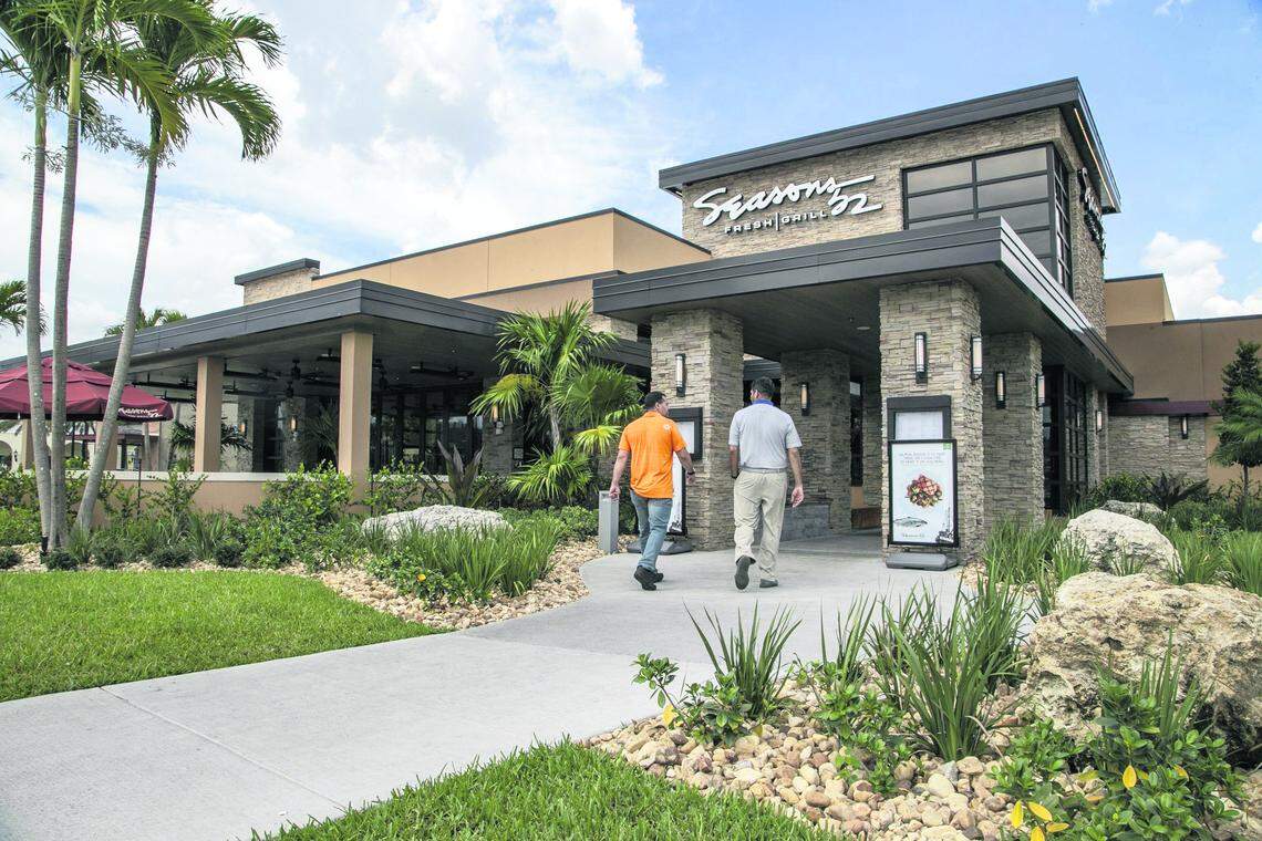 Customers arrive at Seasons 52 restaurant at Sawgrass Mills, one of many dining options in the mall that is a major tourist attraction.