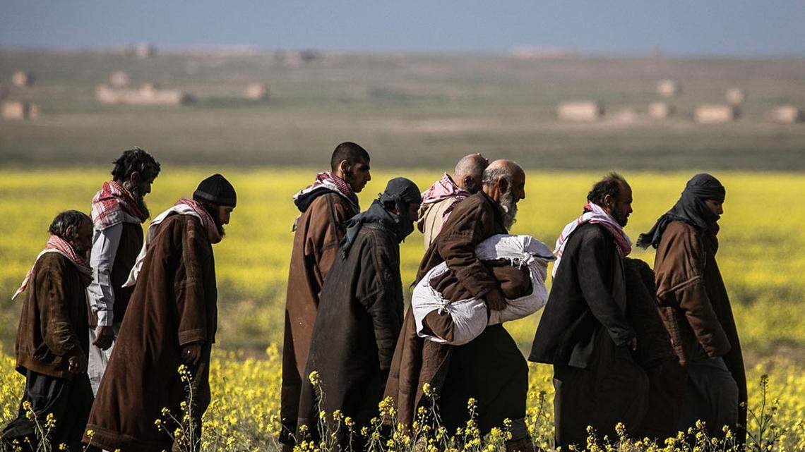 Suspected ISIS fighters surrender to U.S.-backed Syrian Democratic Forces.