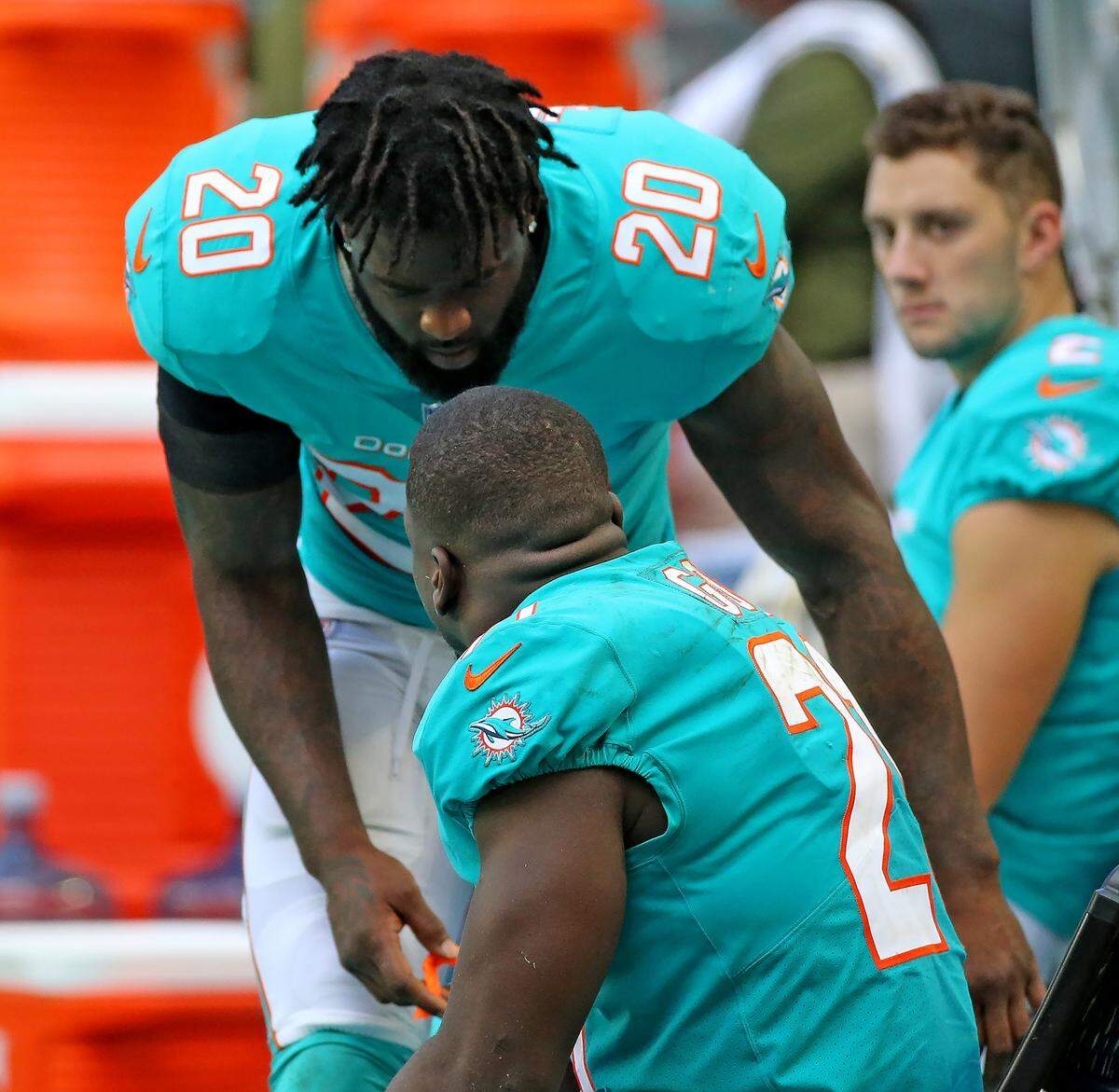 Miami Dolphins Reshad Jones (20) talks with Frank Gore as they play the New York Jets at Hard Rock Stadium in Miami Gardens, Florida, Sunday, November, 4, 2018.