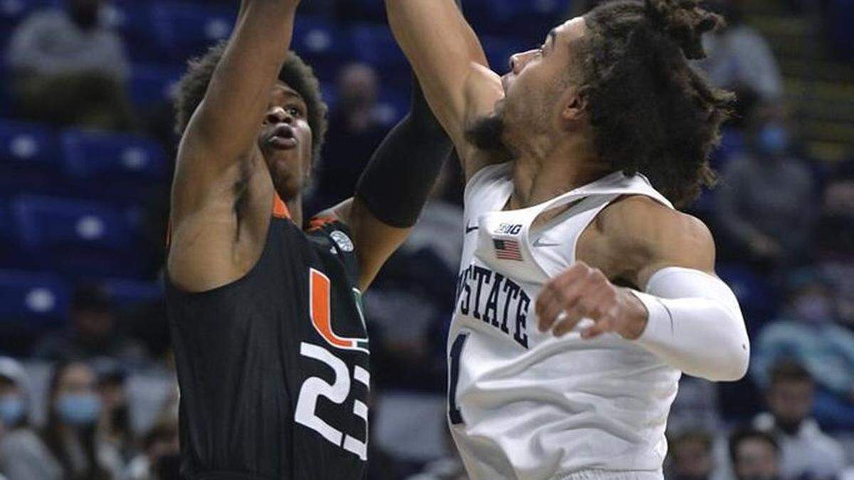 Kam McGusty (left) scored 12 second-half points to help lead the University of Miami to a 63-58 win over Penn State in the ACC/Big Ten Challenge.