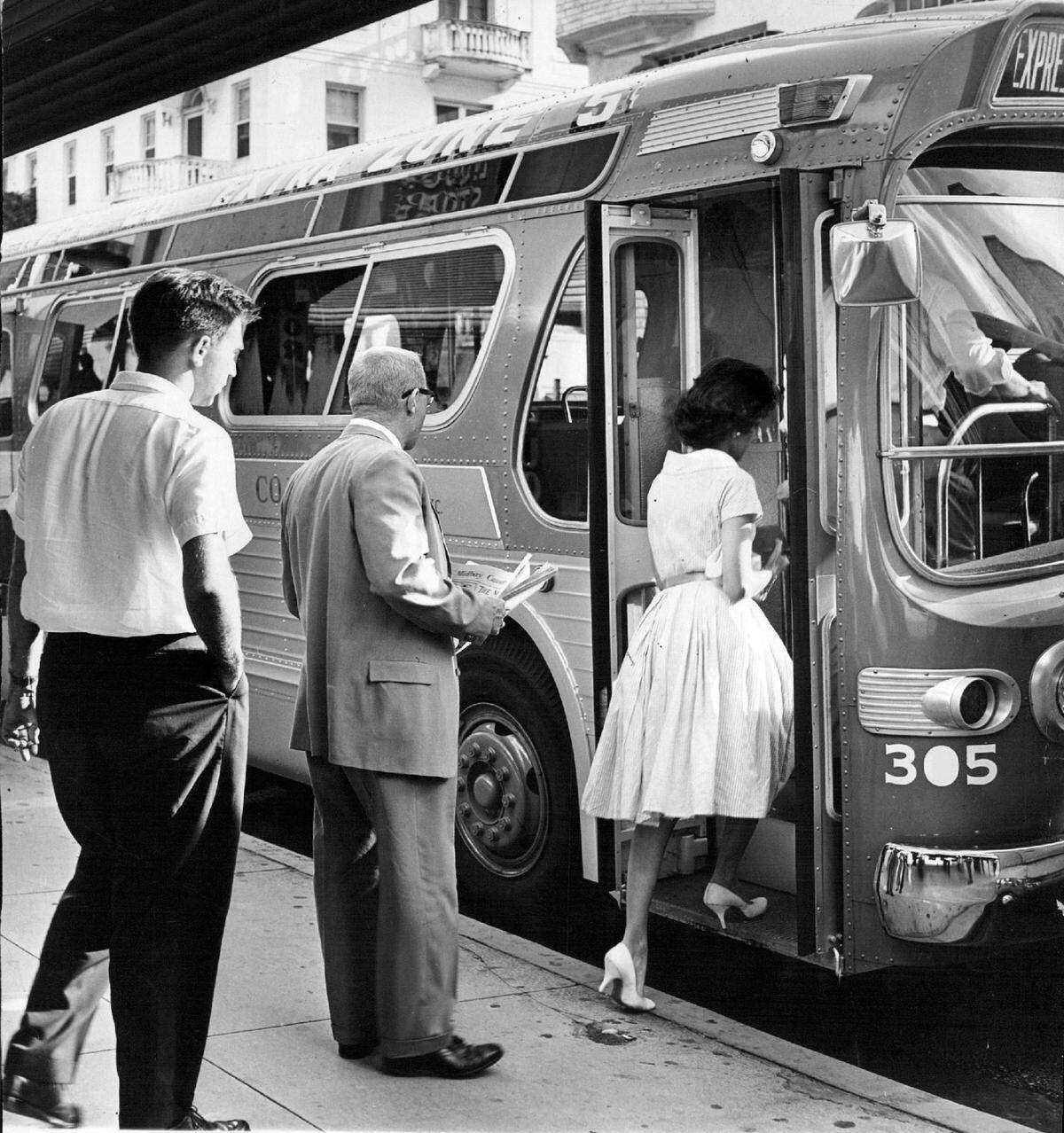 In 1960, passnegers board a bus to reach the South Miami area from downtown Miami.