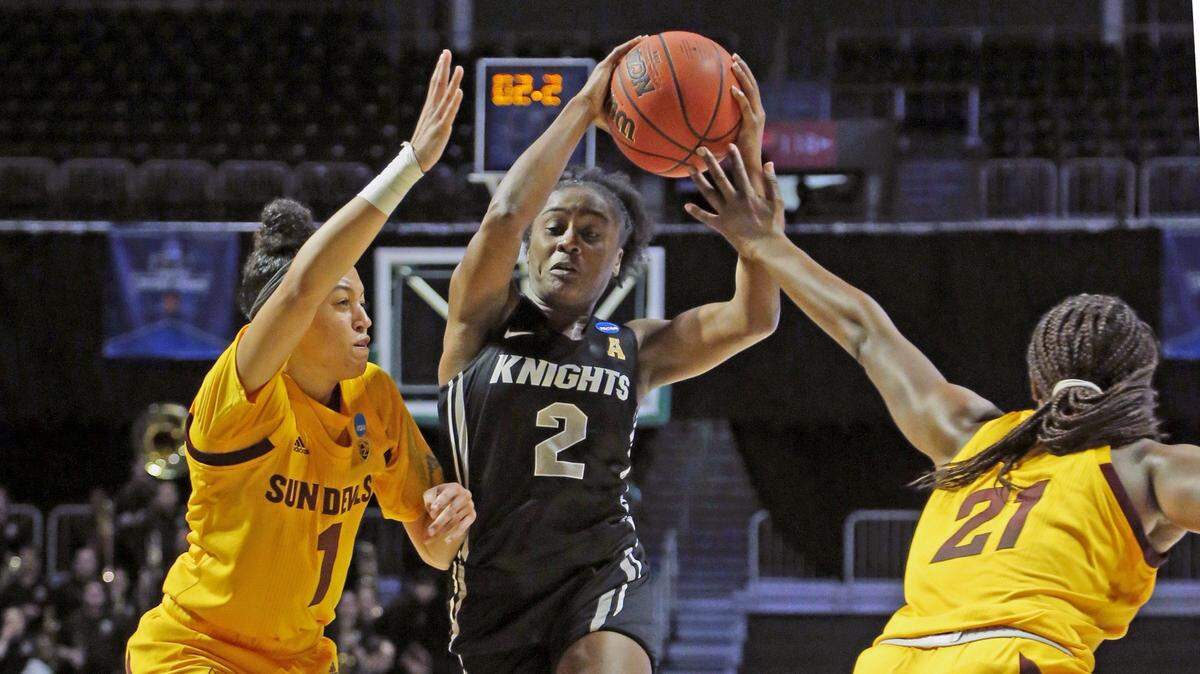 UCF Knights guard Kay Kay Wright (2) attempts to get around defenders Arizona State Sun Devils guard Reili Richardson (1) and forward Sophia Elenga (21) at the Watsco Center in Coral Gables on Friday, March 22, 2019.