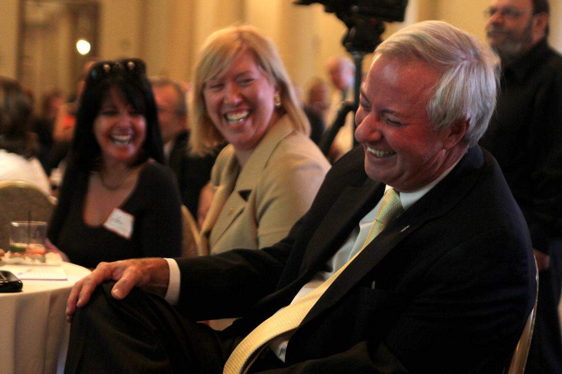 Former Mayor Don Slesnick, front right, cracks up as friends and former Coral Gables commissioners offer humorous suggestions, including perhaps an appearance on “Dancing With the Stars” and working for his wife Jeannett, in center, of what the former mayor could do next after serving more than 10 years as Mayor of Coral Gables during a reception at the Biltmore Hotel in this file photo from June 8, 2011.