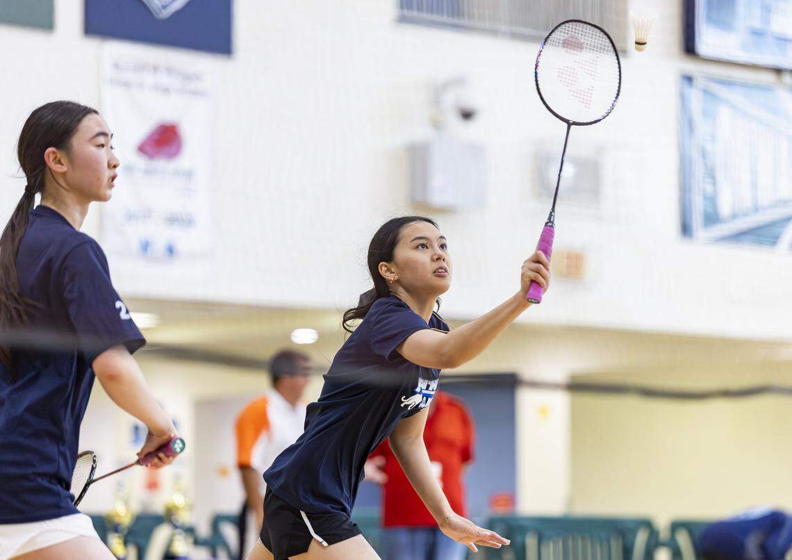 Miami Palmetto Senior High School student British Chau returns a shot as she competes in the girls doubles GMAC badminton championship at Ronald W. Reagan Doral Senior High School on Wednesday, April 22, 2026, in Doral, Fla.