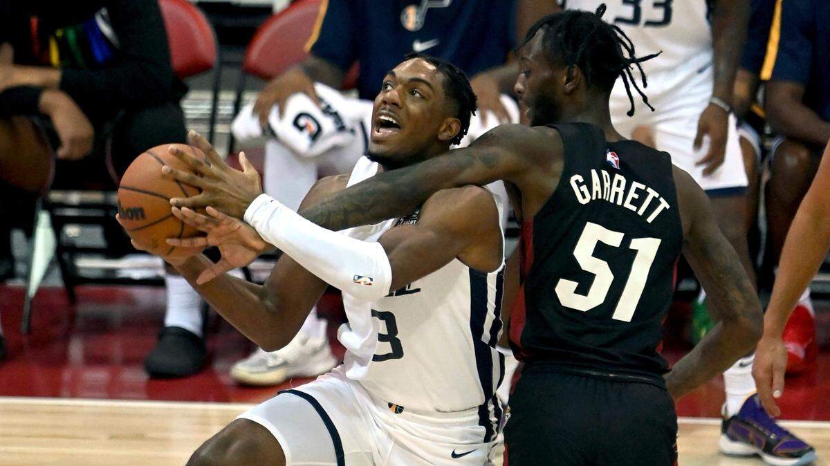 Utah Jazz guard Trent Forrest (3) drives to the basket against Miami Heat guard Marcus Garrett (51) during the first half of an NBA summer league basketball game Friday, Aug. 13, 2021, in Las Vegas.