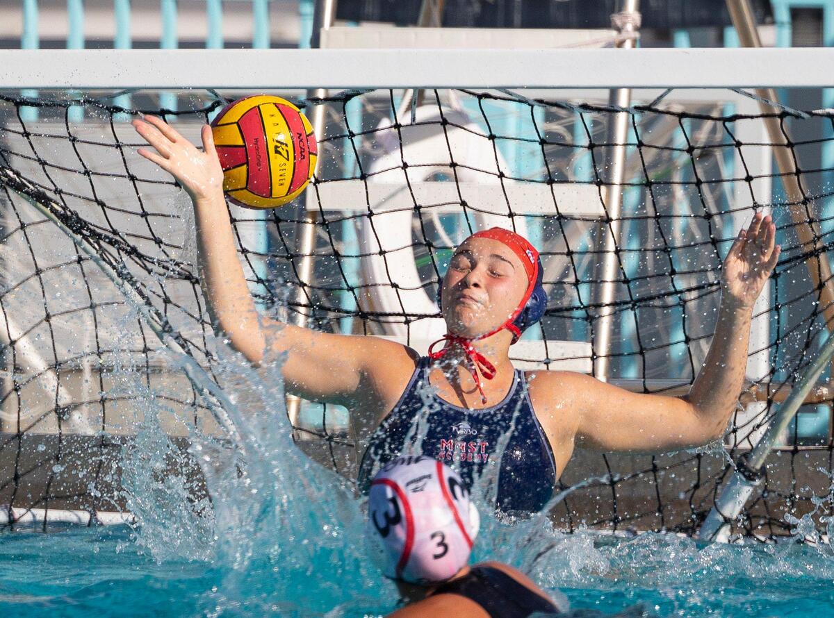 MAST’s goal tender Ana Dalbo (1) blocks a shot during the third quarter of the GMAC girls water polo finals on Wednesday, March 20, 2024, at MAST Academy on Virginia Key.