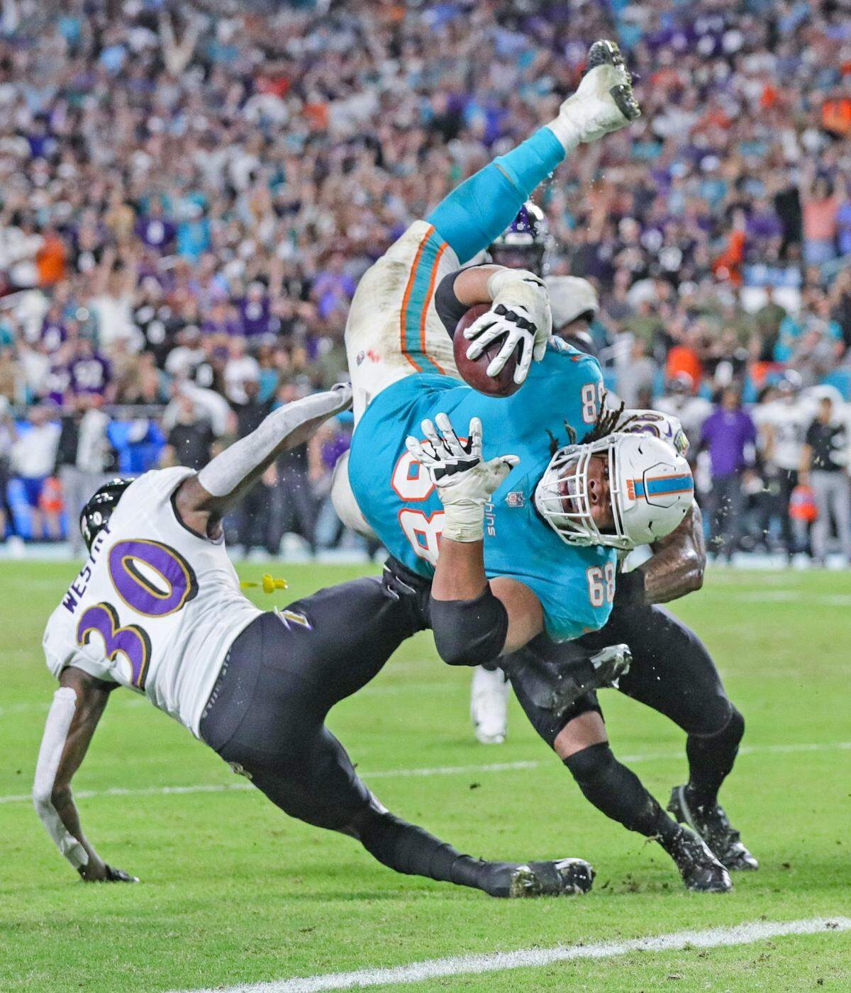 Miami Dolphins guard Robert Hunt (68) dives to the goal line in the fourth quarter but the officials ruled against Miami during a game against the Baltimore Ravens at Hard Rock Stadium on Thursday, Nov. 11, 2021.