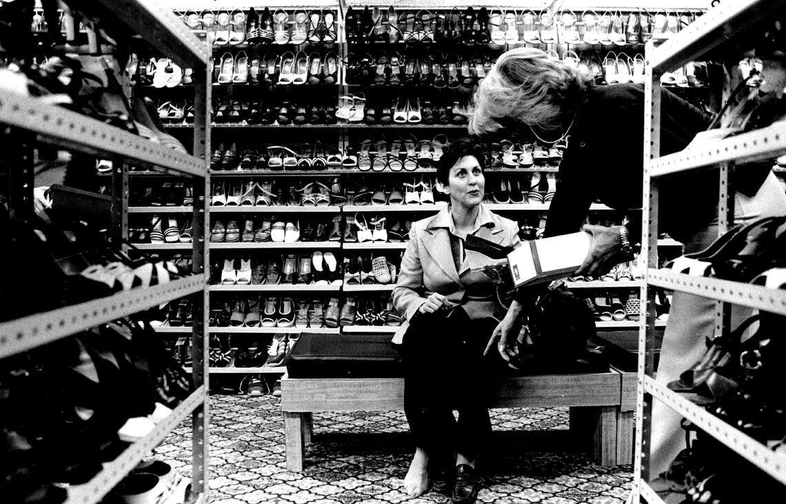 A customer shops for shoes in the Miami Garment District.