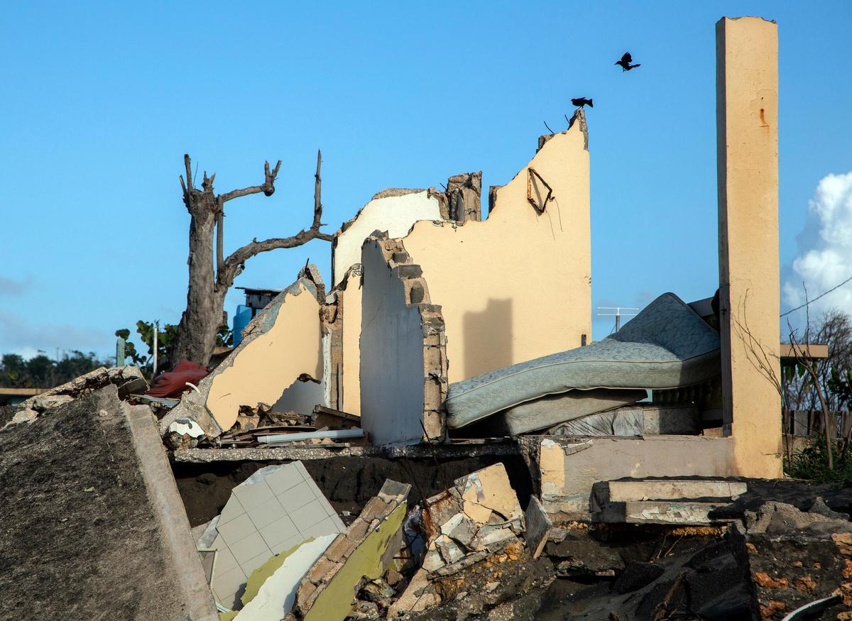 What remains of a home battered by the Atlantic Ocean along the coast in La Boca, Barceloneta, Puerto Rico, is shown a year after Hurricane Maria hit the island.