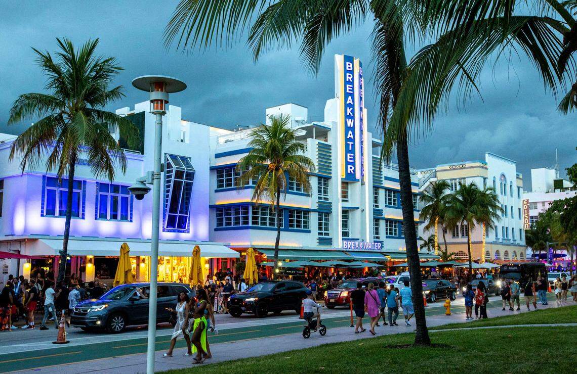 People walk Ocean Drive during the second day of Memorial Day Weekend in Miami Beach, Florida, on Saturday, May 28, 2022.