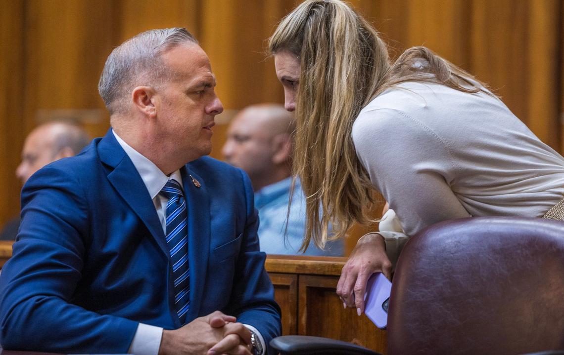 Aimee Artiles talks to her husband Frank Artiles, the former Florida GOP senator accused of paying a ghost candidate more than $40,000 to influence a Florida Senate seat election with a heavily favored Democratic candidate, appears in court during his trial, in front of Judge Miguel M. de la O, at Courtroom 4-1 at the Richard E. Gerstein Justice Building in Miami, Florida, on Friday September 20, 2024.