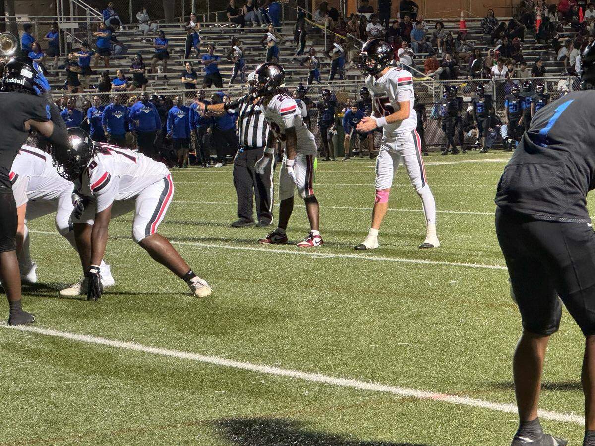 Southridge quarterback James Perrone prepares to take a snap during Friday’s 33-7 win over Homestead South Dade at Harris Field in Homestead, Fla.