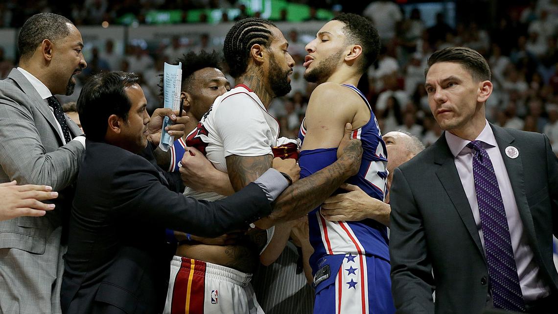 From left, Heat assistant coach Juwan Howard, head coach Erik Spoelstra and referee Jason Phillips intervene to stop an argument between Heat forward James Johnson and Philadelphia's guard Ben Simmons in the second quarter of Game 4 in the first-round playoff series between the Miami Heat and the Philadelphia 76ers, at AmericanAirlines Arena in Miami on Saturday, April 21, 2018.