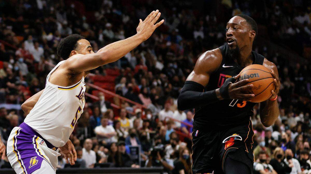 Miami Heat center Bam Adebayo (13) drive against Los Angeles Lakers guard Talen Horton-Tucker (5) during the second quarter of their NBA basketball game at the FTX Arena on Sunday, January 23, 2022 in Miami, Fl.