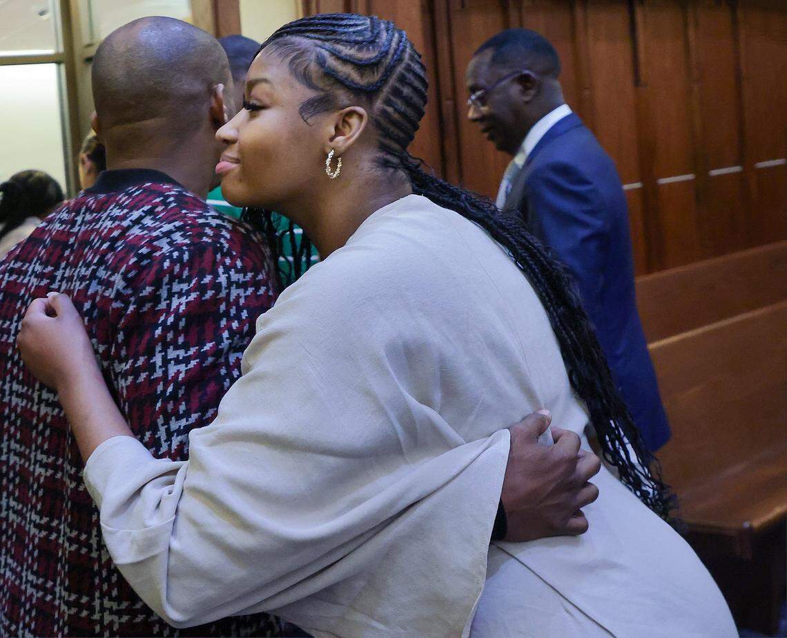 Jahara Malik, center, embraces supporters as she leaves the courtroom after pleading guilty to a manslaughter charge in connection with the 2024 stabbing death of Yahkeim Lollar, a Northwestern student-athlete, in front of Judge Christine Hernandez in Courtroom 2-8 at the Richard E. Gerstein Justice Building on Monday, March 16, 2026, in Miami, Florida.